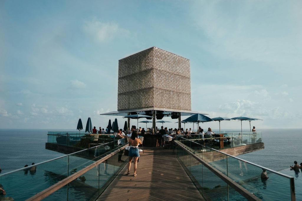 people walking on wooden dock near building during daytime
